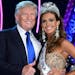 Donald Trump (L) and Miss Connecticut USA Erin Brady pose onstage after Brady won the 2013 Miss USA pageant at PH Live at Planet Hollywood Resort & Ca
