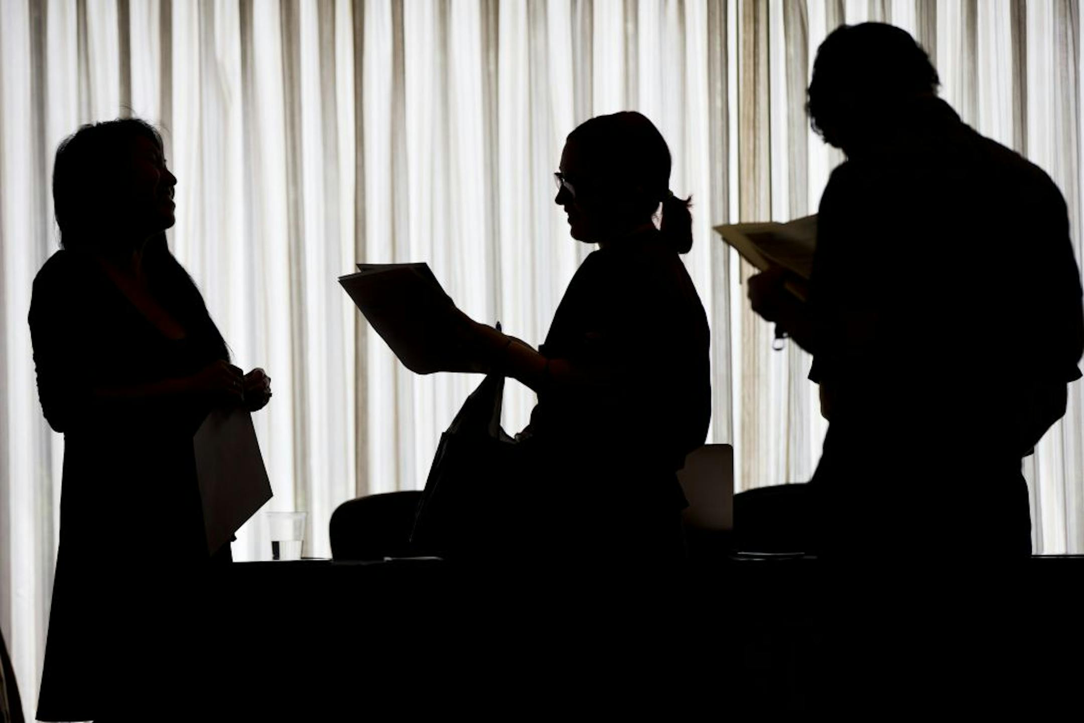 FILE In this June 23, 2014 file photo, recruiter Christina O, left, with New Western Acquisitions, meets with employment seekers during a job fair in Philadelphia. As the economic recovery enters its sixth year, many Americans don't feel better off. The strong jobs report on Friday, Nov. 7, 2014, showed that the jobless rate the most closely watched gauge of the economy�s health is down to 5.8 percent. After Tuesday�s midterm elections, exit polling showed how little falling unemployment has res