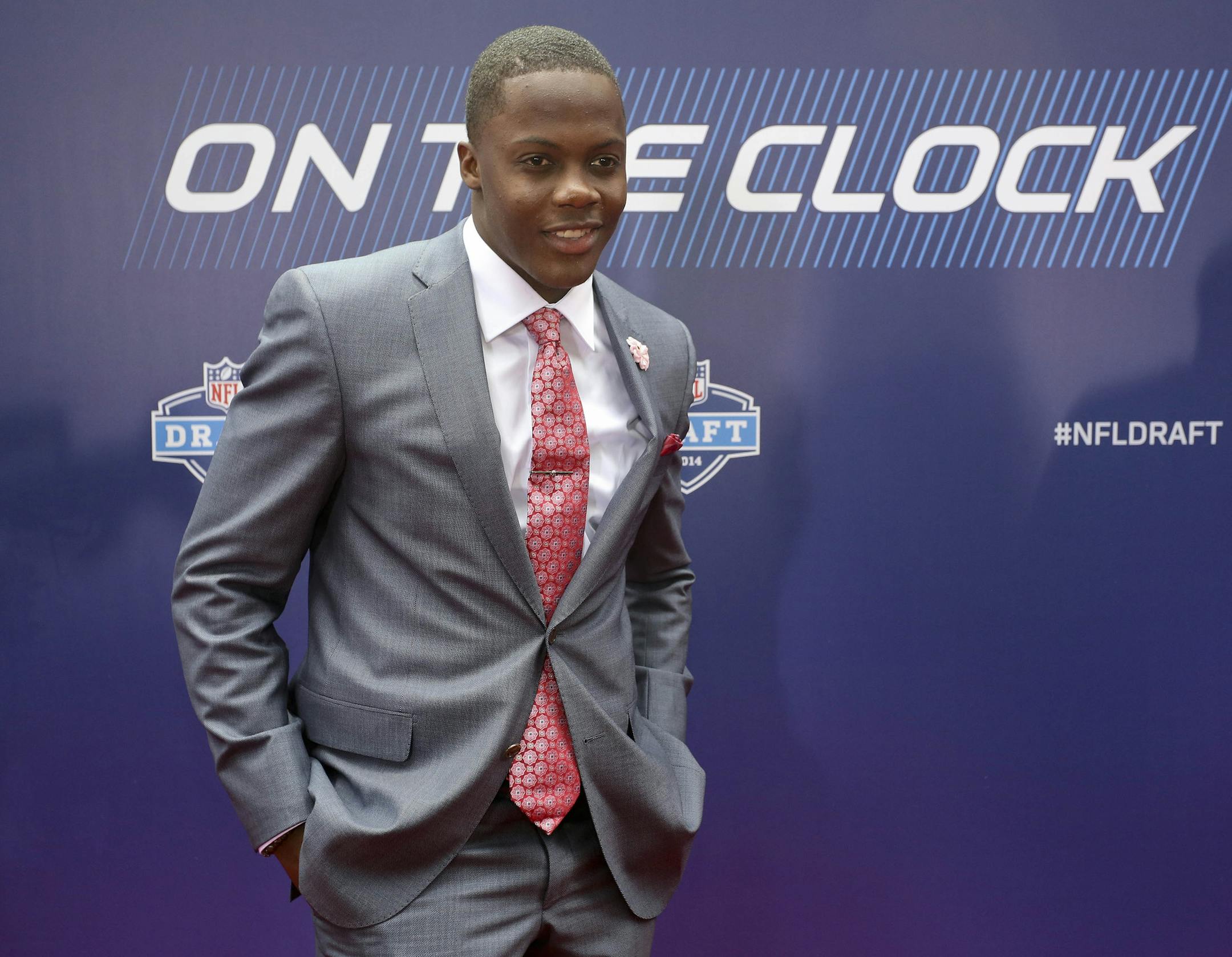 Louisville quarterback Teddy Bridgewater poses for photos upon arriving for the first round of the 2014 NFL Draft at Radio City Music Hall, Thursday, May 8, 2014, in New York. (AP Photo/Craig Ruttle)