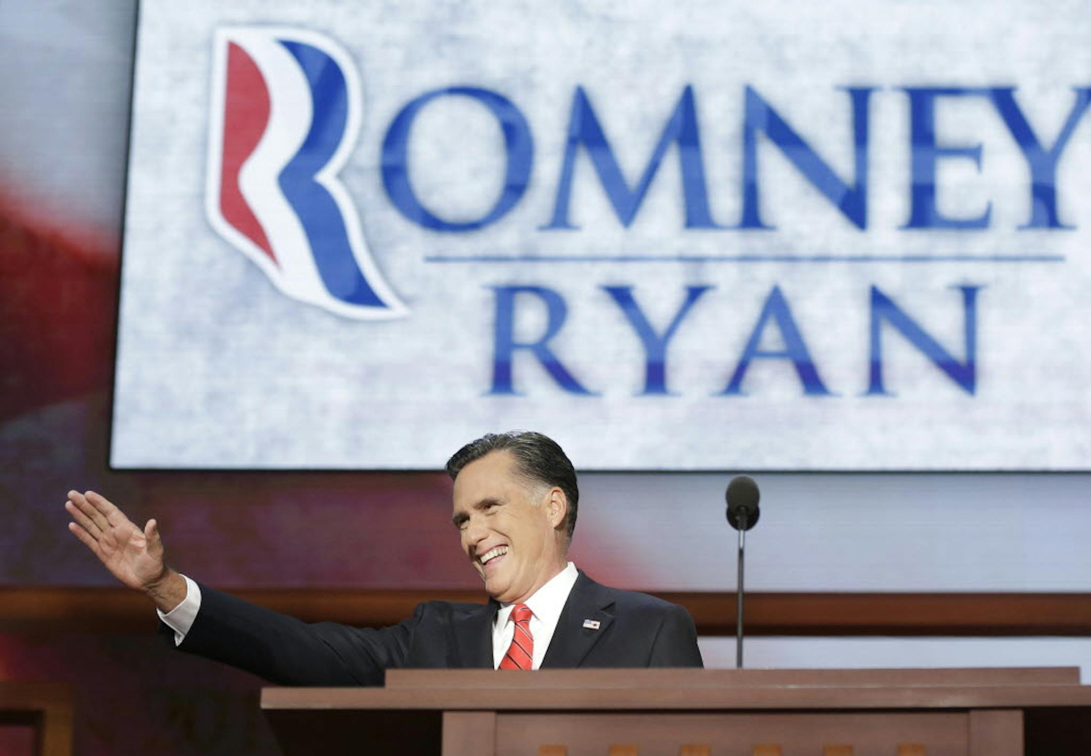 Republican presidential nominee Mitt Romney acknowledges delegates before speaking at the Republican National Convention.