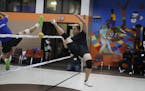 True Cha right scored a point on Alex Wahhoo Wah during a game of sepak Takraw at the Duluth and Case Recreation Center Tuesday February 21, 2017 in S