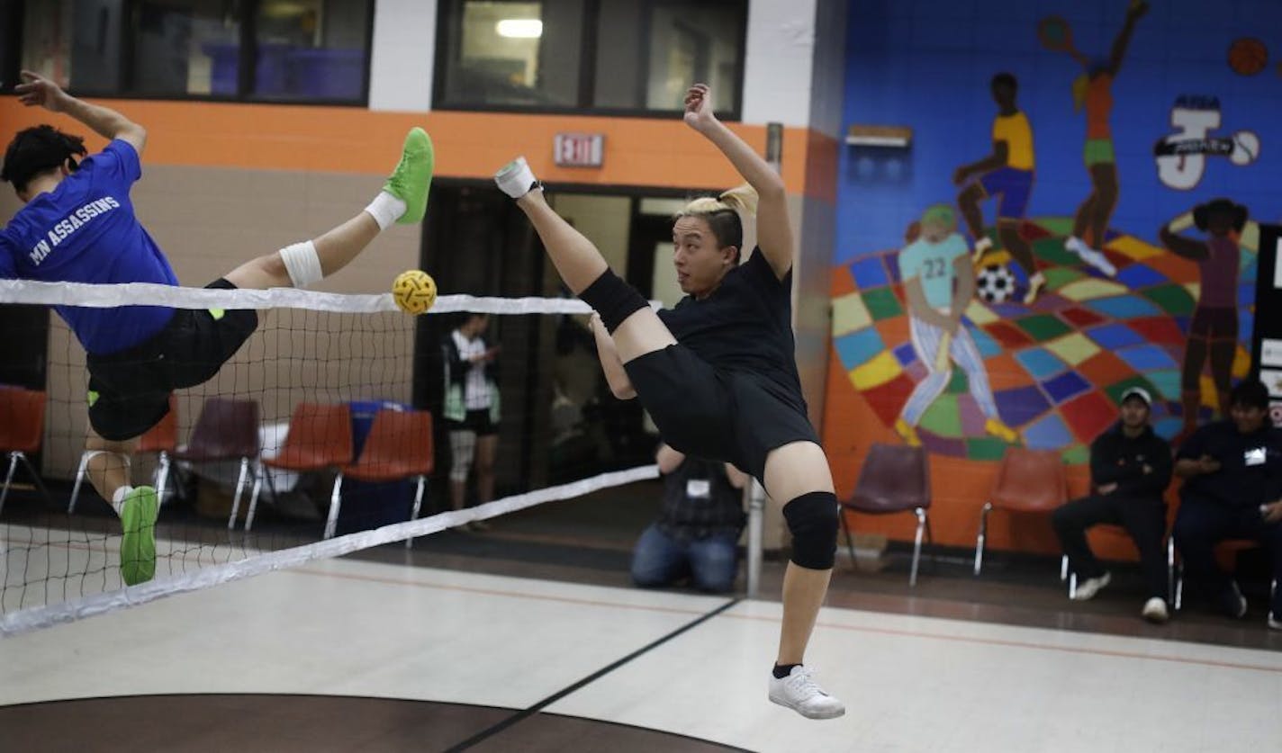 True Cha right scored a point on Alex Wahhoo Wah during a game of sepak Takraw at the Duluth and Case Recreation Center Tuesday February 21, 2017 in St. Paul, MN.