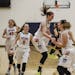Orono teammates celebrate in the last few seconds of the game on Thursday, March 9, 2017, at Chanhassen High School in Chanhassen, Minn.