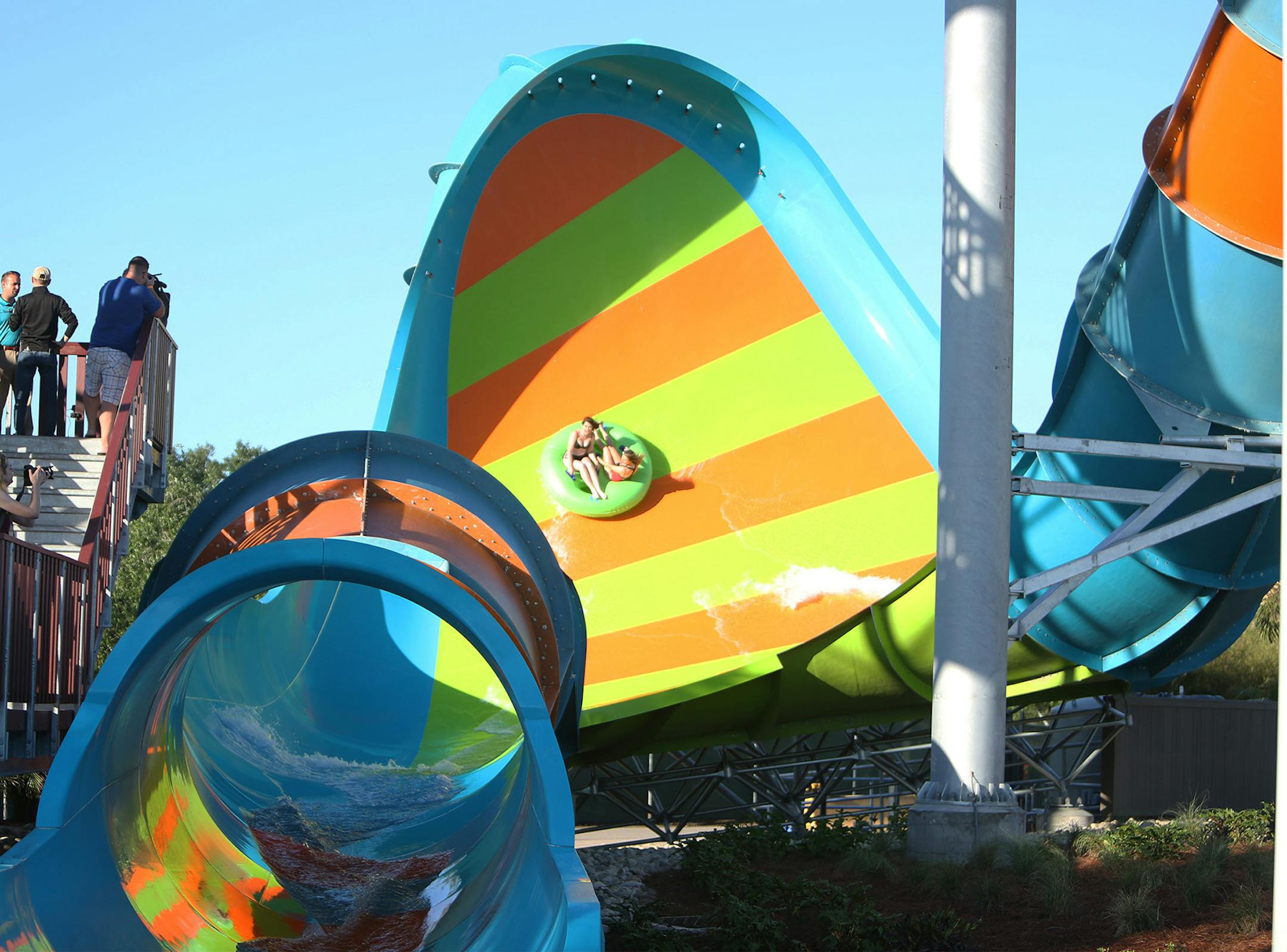 Aquatica Orlando's newest water slide, KareKare Curl, opened in April 2019. Two riders, who face each other on the raft, experience a 35-foot drop in the enclosed tube and then rush up a vertical wave wall. The ride takes about 15 to 20 seconds to complete. (Rich Pope/Orlando Sentinel/TNS)