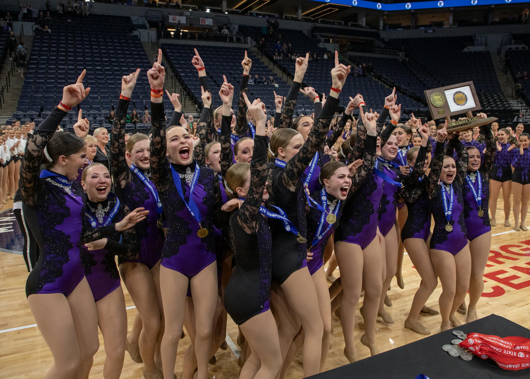 Wayzata celebrates winning the Class 3A High Kick championship.