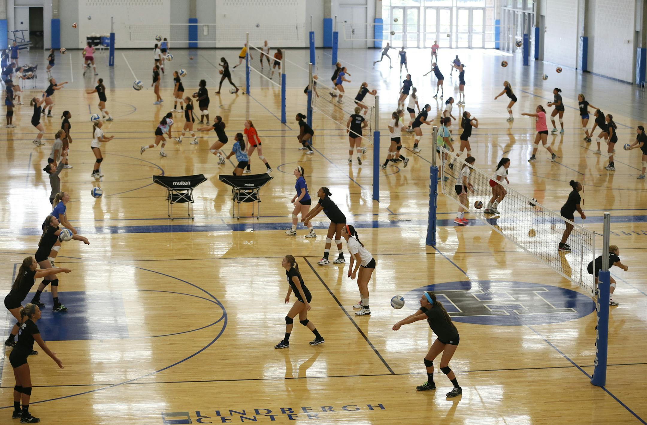 Members of the Hopkins high volley ball team worked on drills during the first day of Hopkins High volley ball practice , Monday Aug 12 ,2013 in Hopkins, MN. ] JERRY HOLT ‚Ä¢ jerry.holt@startribune.com