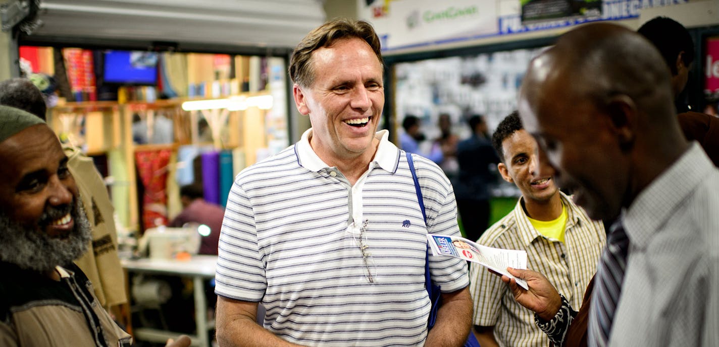 State Rep. Jim Abeler asked Somalis for their vote in the August 12 primary in his race against Mike McFadden to go up against Sen. Al Franken for the U.S. Senate seat. He handed out brochures in both English and Somali Friday after prayers at Somali Village Market in Minneapolis. ] Friday, August 1, 2014. GLEN STUBBE * gstubbe@startribune.com ORG XMIT: MIN1408011641271205 ORG XMIT: MIN1408011735261244