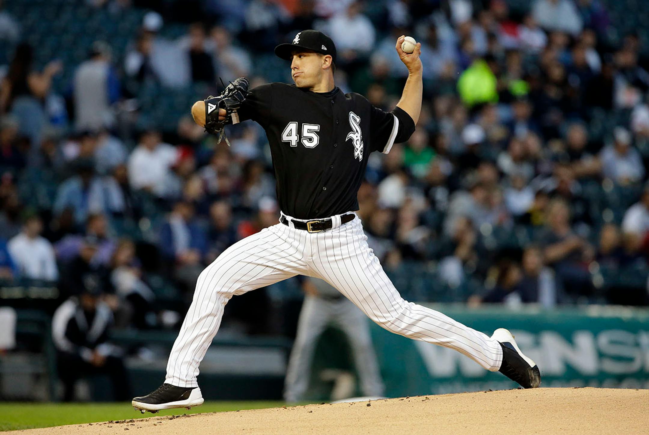 Chicago White Sox starting pitcher Derek Holland throws against the Minnesota Twins during the first inning of a baseball game Thursday, Aug. 24, 2017, in Chicago.