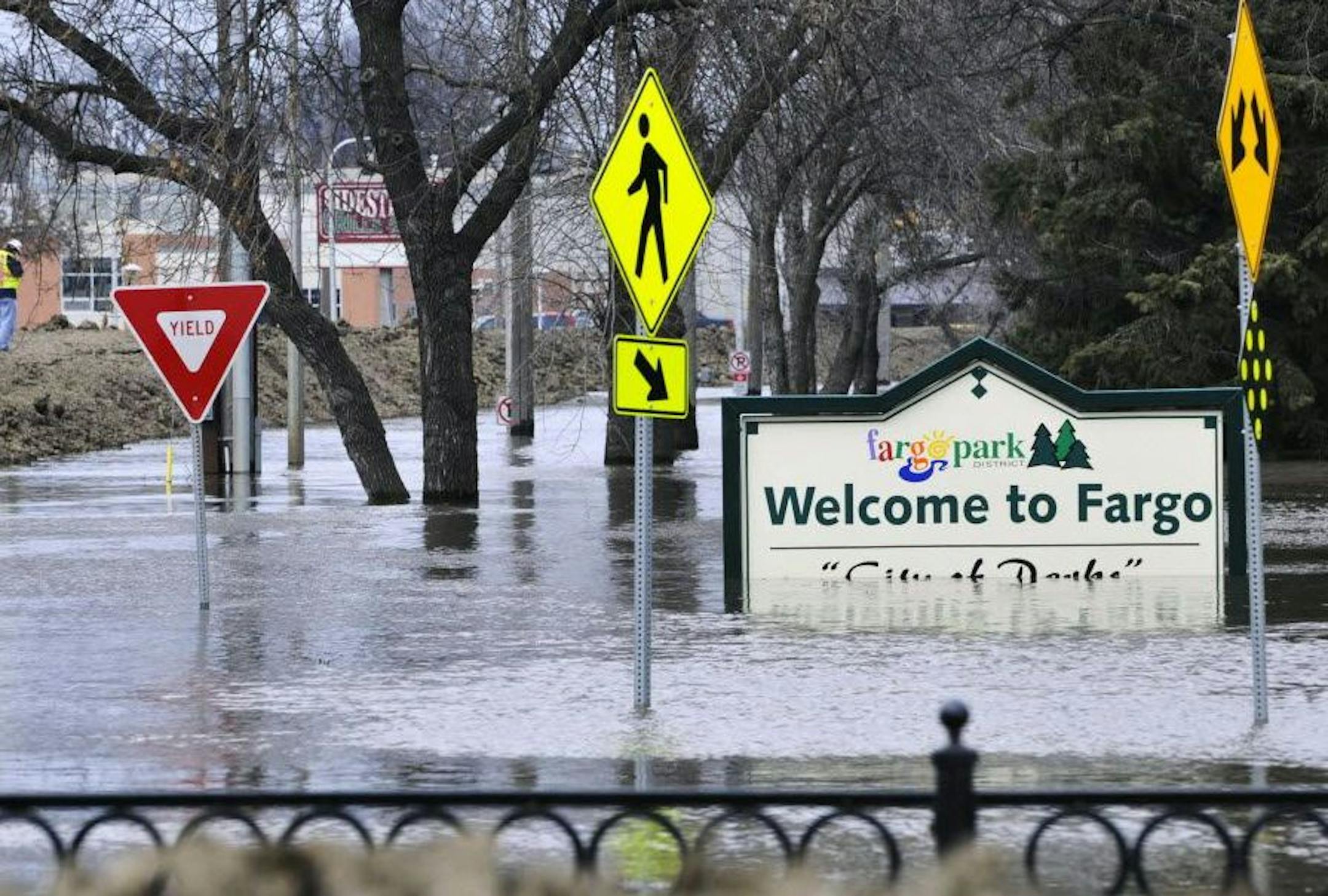 Fargo won't be able to start work on its $2.1 billion flood control project until Minnesota decides whether to permit the project. In 2011, floodwaters soaked portions of flood-prone Fargo.