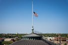 The flags flying over the State Capitol were lowered to half staff. GLEN STUBBE • glen.stubbe@startribune.com
