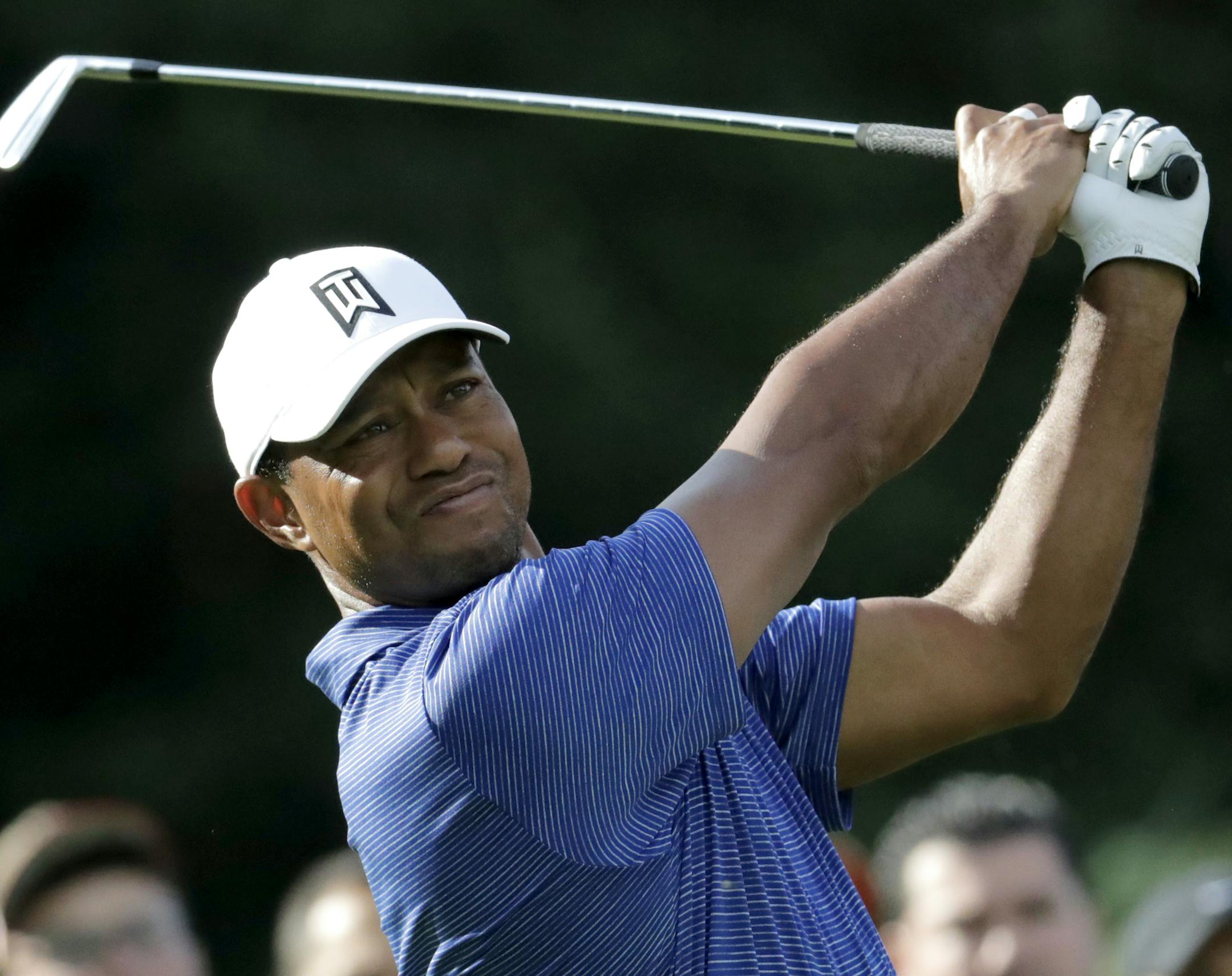 Tiger Woods tees off on the 12th hole during the first round of the Northern Trust golf tournament, Thursday, Aug. 23, 2018, in Paramus, N.J. (AP Photo/Julio Cortez)