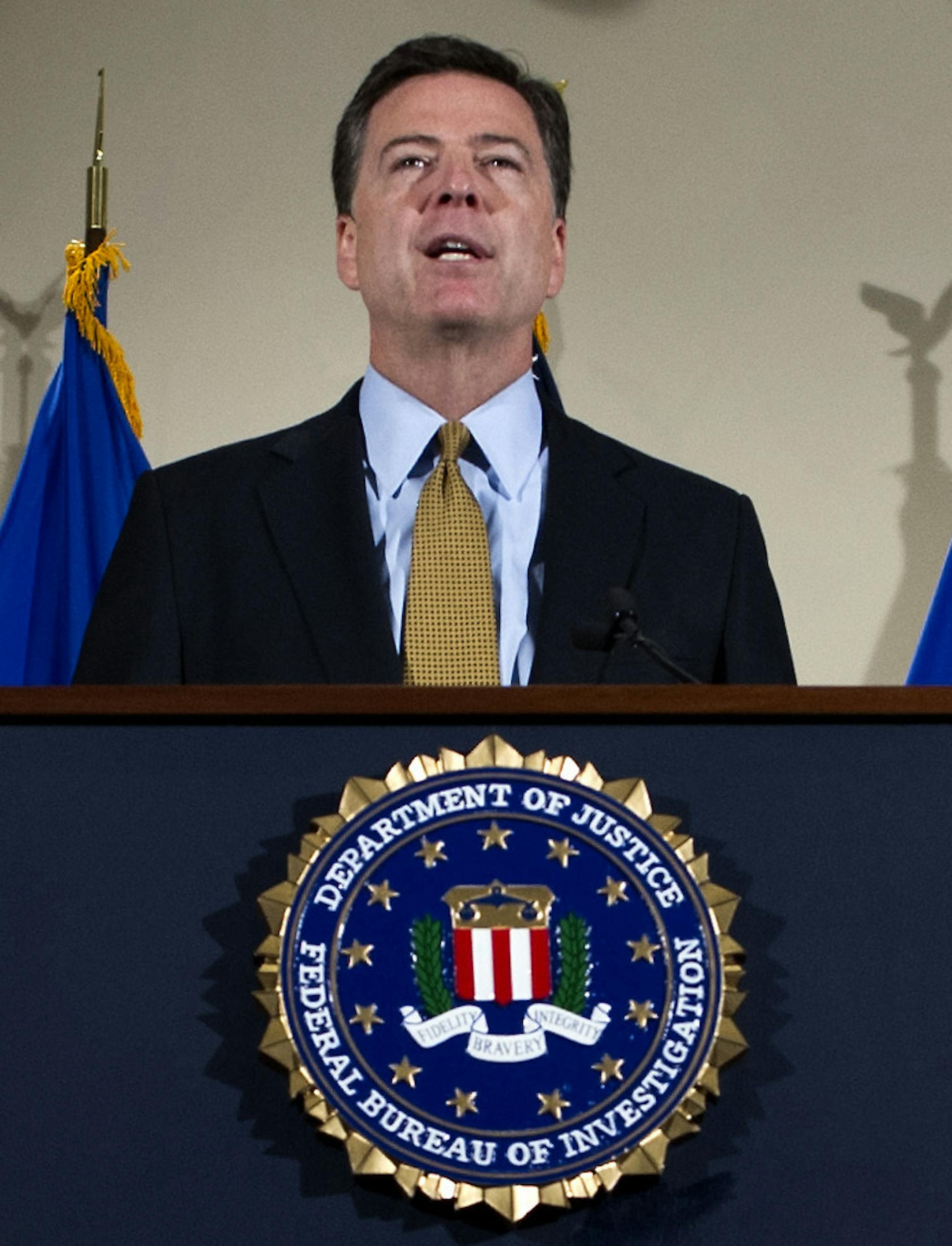 FBI Director James Comey makes a statement at FBI Headquarters in Washington, Tuesday, July 5, 2016. Comey said the FBI will not recommend criminal charges in its investigation into Hillary Clinton's use of a private email server while secretary of state. (AP Photo/Cliff Owen) ORG XMIT: DCCO114
