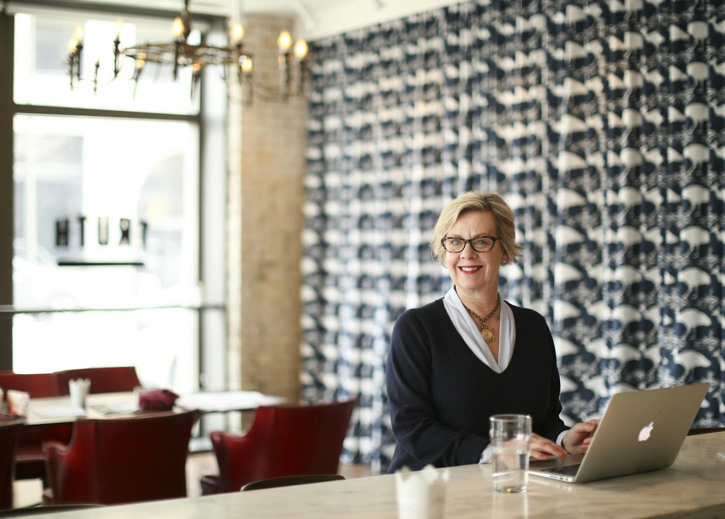 CEO Sue Kruskopf working at the marble bar in the Truth Bar, the new Kruskopf & Co. workspace Wednesday afternoon. ] JEFF WHEELER &#xef; jeff.wheeler@startribune.com Sue Kruskopf, CEO of the ad agency Kruskopf & Co. figured the world didn't need another conference room, so when she decided to expand her business' footprint in the Flour Exchange building, she had a street level space that had been dormant for 25 years remade as a casual workspace that to the untrained eye looks an awful lot like