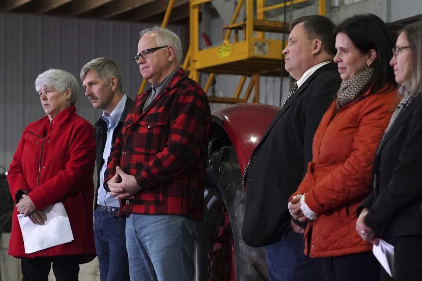 Gov.-elect Tim Walz stands with some of the seven commissioners he announced during a news conference Thursday, Jan. 3, 2019 at Bill Sorg's Dairy Farm in Hastings, Minn.