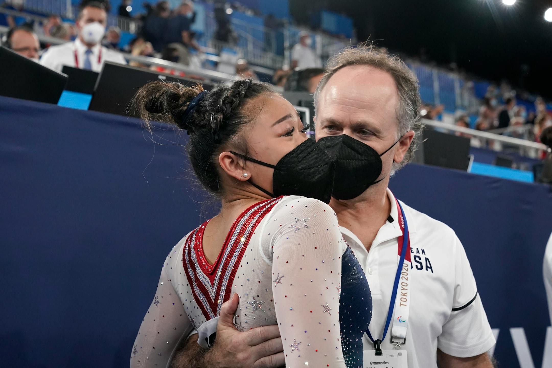 Suni Lee, of the United States, celebrates with her coach Jeff Graba after she won the gold medal in the artistic gymnastics women's all-around at the 2020 Summer Olympics, Thursday, July 29, 2021, in Tokyo. (AP Photo/Gregory Bull)