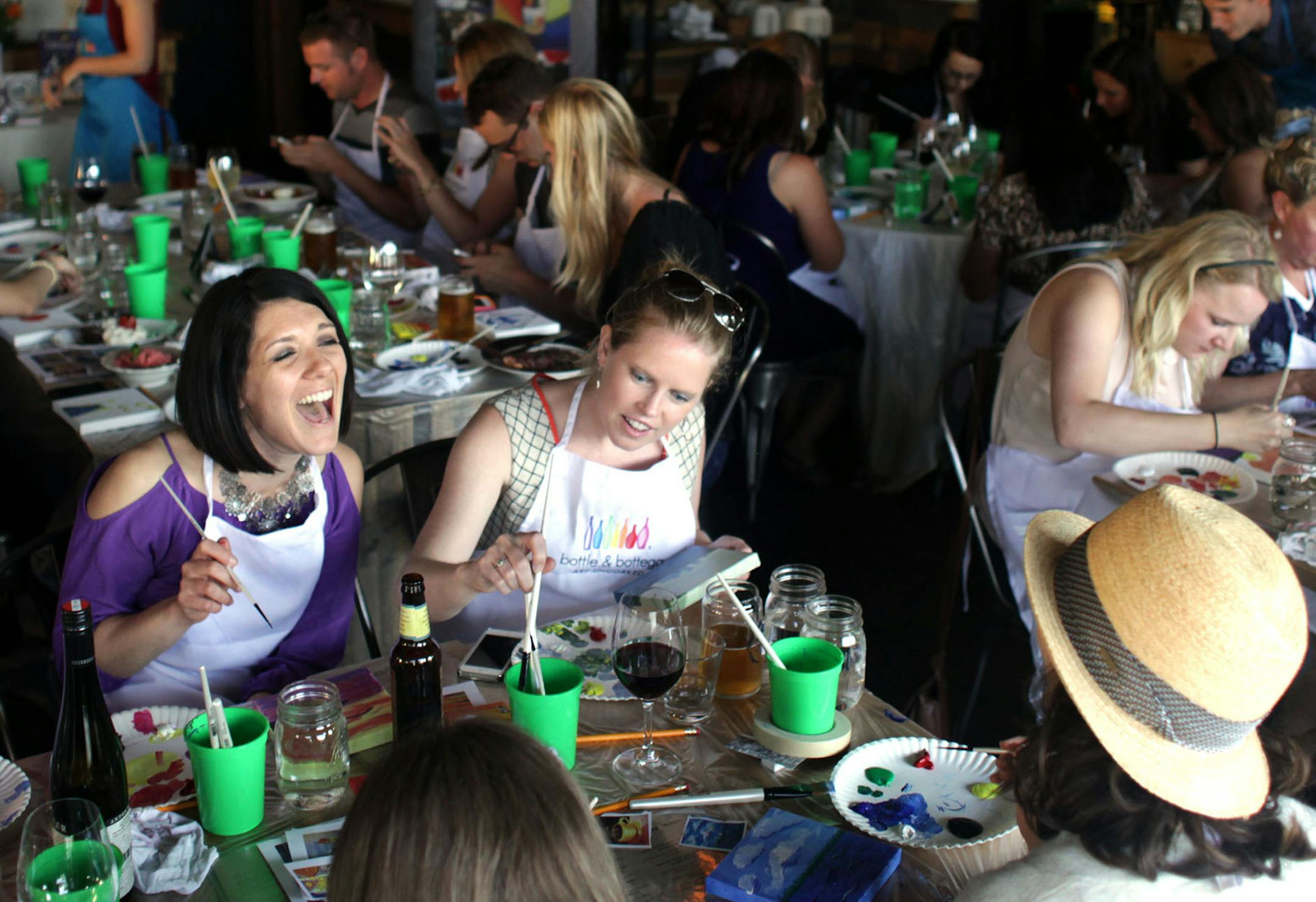 Bottle and Bottega Minneapolis hosted their first "Paint 'n Sip" event at Spill the Wine in Uptown on Tuesday night. ] Artists coached attendees on painting specific images. MONICA HERNDON monica.herndon@startribune.com Minneapolis, MN 06/04/2014