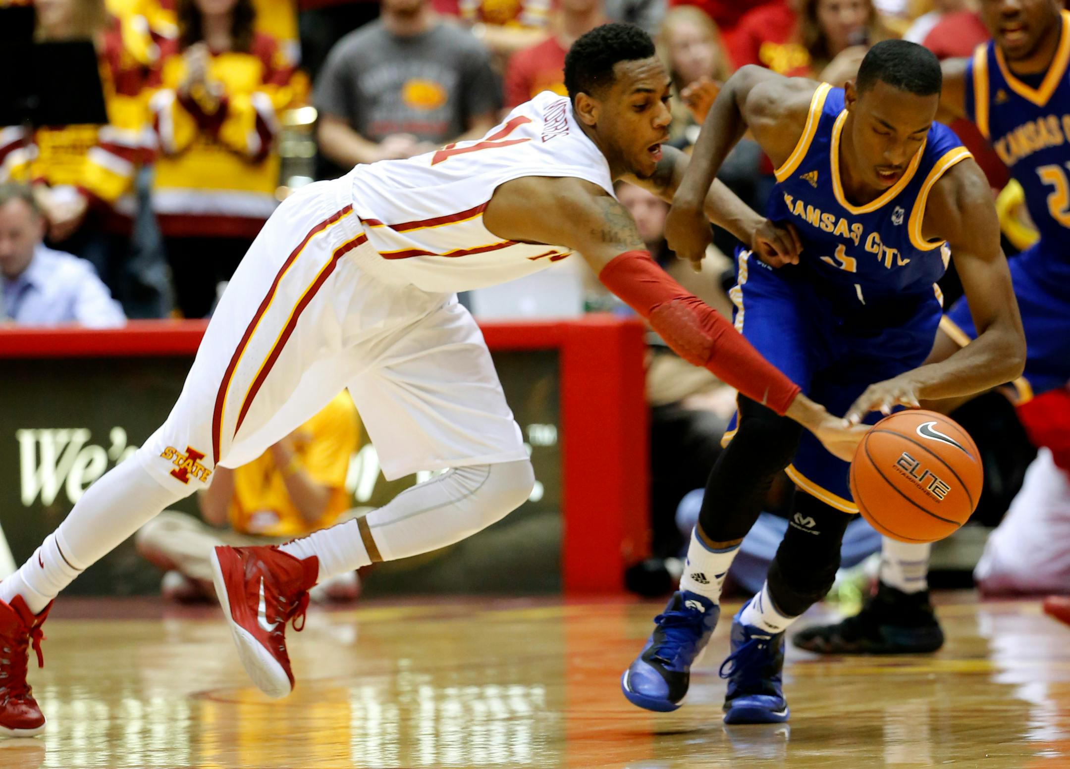 Iowa State guard Monte Morris steals the ball away from UKMC guard Deshon Taylor during the second half of an NCAA college basketball game, Tuesday, Dec. 9, 2014, in Ames, Iowa. Iowa State won the game 73-56. (AP Photo/Justin Hayworth)