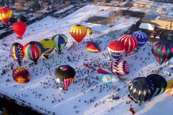 The Hot Air Affair in Hudson, Wis., attracts as many as 40 hot air balloons. The year's event has a Super Bowl theme.