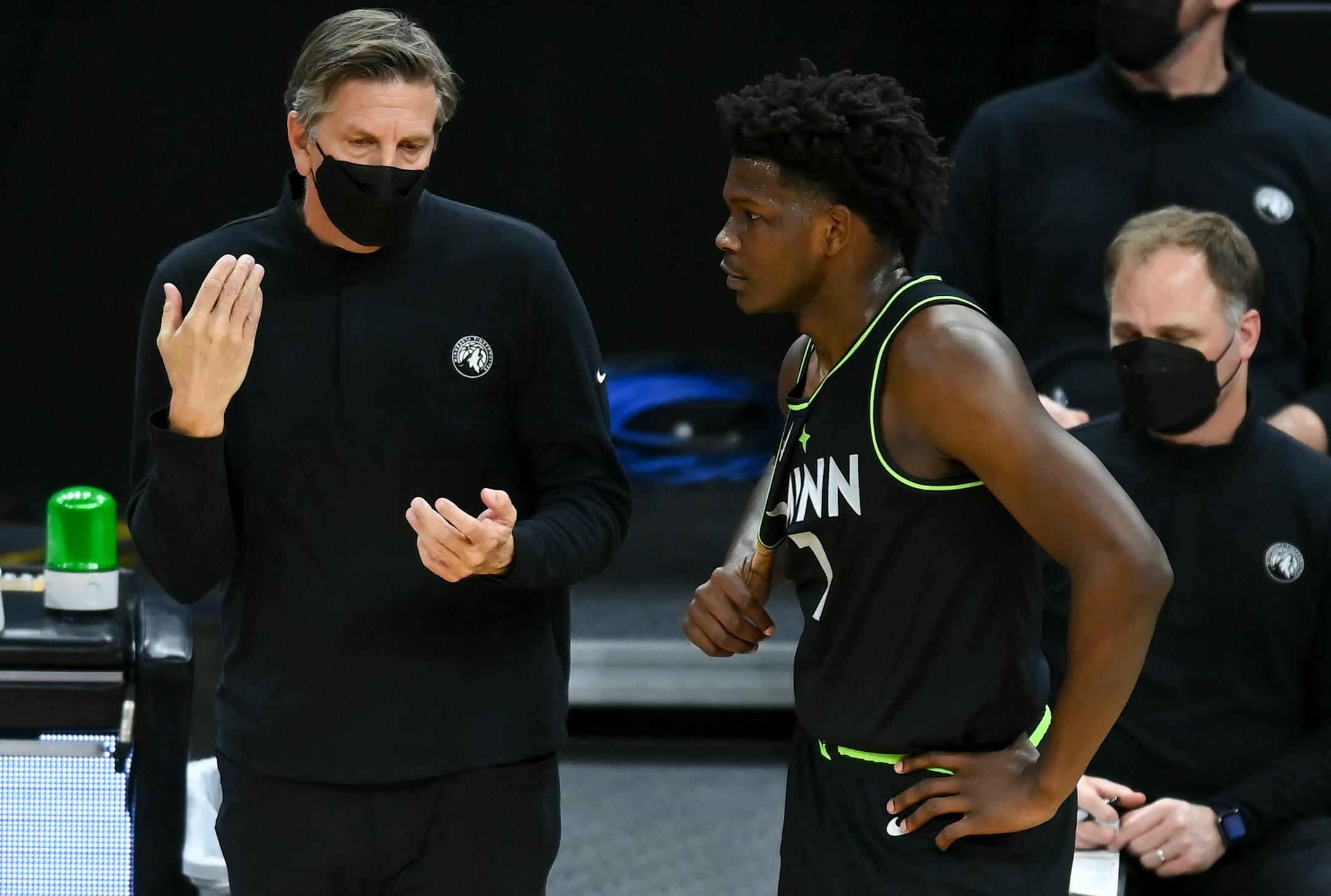 Minnesota Timberwolves head coach Chris Finch talked things over with forward Anthony Edwards (1) during a first half break in the action.