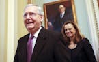 Senate Majority Leader Mitch McConnell of Ky., walks back to his office on Capitol Hill in Washington, Monday, Jan. 22, 2018. Senate leaders have reac