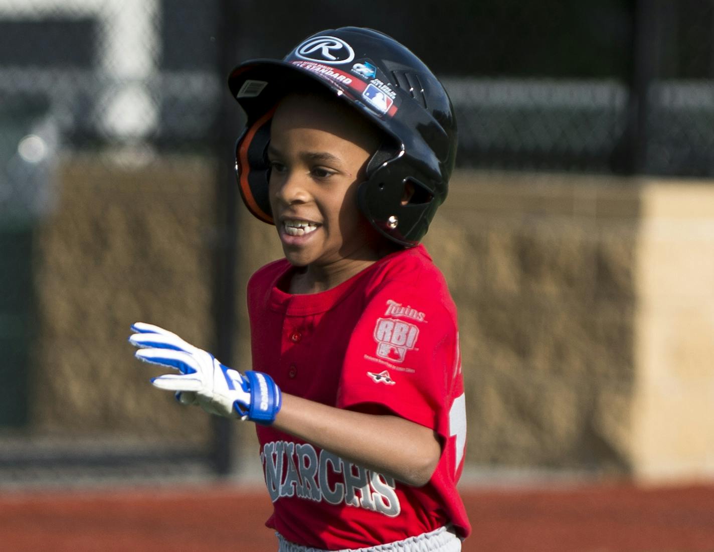 Chris, 8, ran to home to score a run during the Monarchs scrimmage.