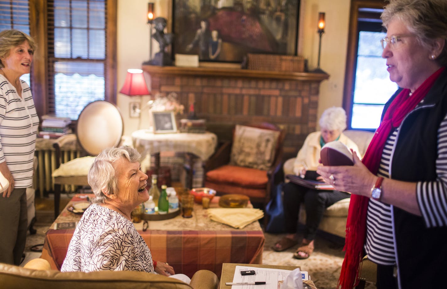 Writer Faith Sullivan, center, chats with Barbara Strandell before their writers group inside Sullivan's Minneapolis home on Wednesday, September 9, 2015. ] LEILA NAVIDI leila.navidi@startribune.com /