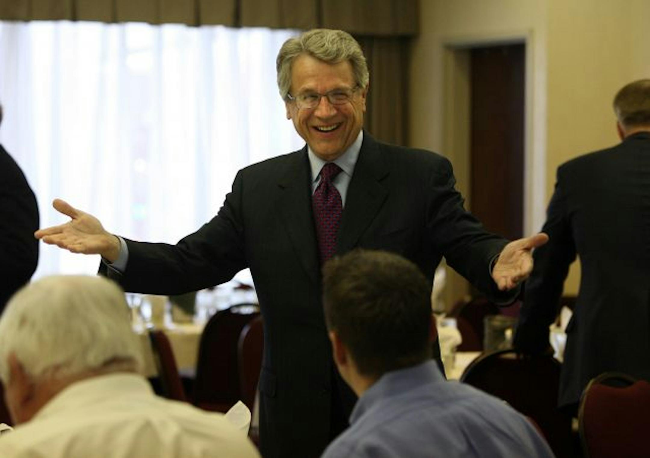 Tom Horner chatted with members during lunch before the start of the debate being held by the St. Cloud Rotary Club and the St. Cloud Chamber of Commerce .