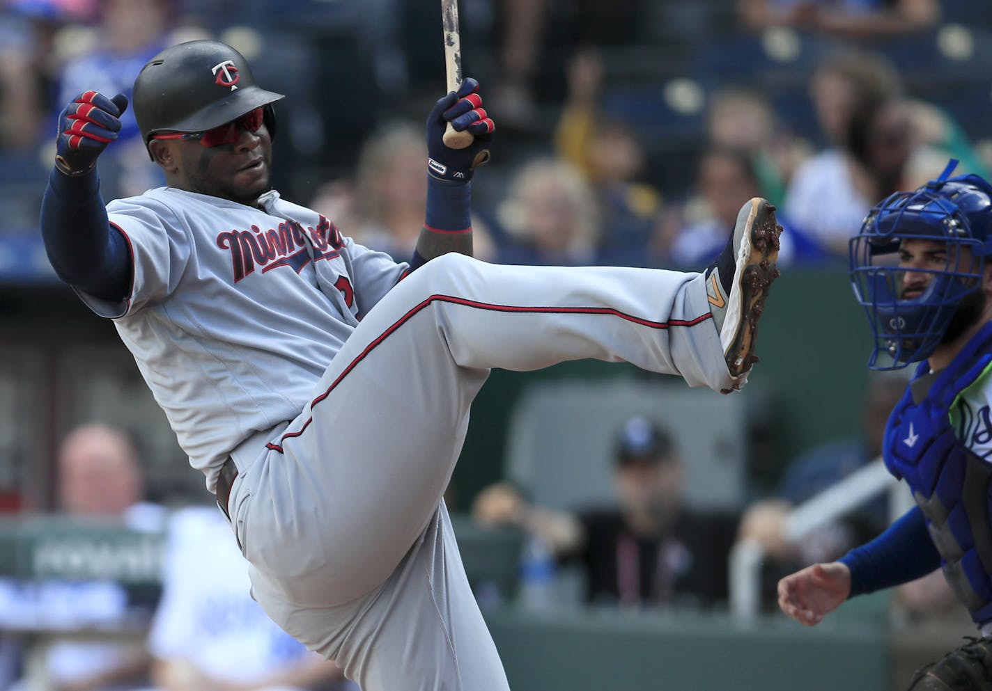 Minnesota Twins designated hitter Miguel Sano, left, is hit by a pitch during the sixth inning of a baseball game against the Kansas City Royals at Kauffman Stadium in Kansas City, Mo., Sunday, Sept. 29, 2019. (AP Photo/Orlin Wagner)