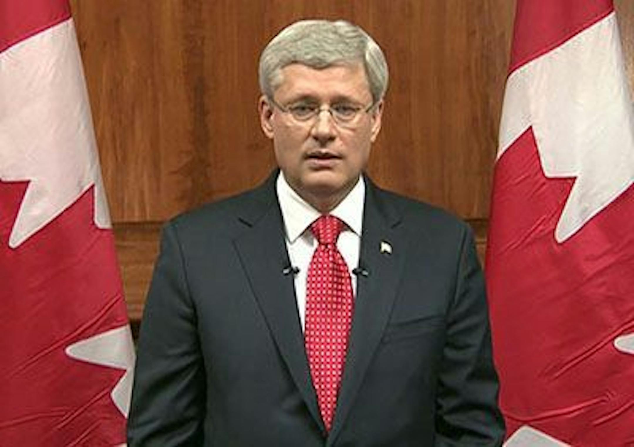 In this frame grab taken from video, Canada Prime Minister Stephen Harper speaks during a televised address to the nation in Ottawa, Ontario, Wednesday, Oct. 22, 2014. A masked gunman killed a soldier standing guard at Canada�s war memorial Wednesday, then stormed Parliament in an attack that was stopped cold when he was shot to death by the ceremonial sergeant-at-arms. Harper called it the country�s second terrorist attack in three days.