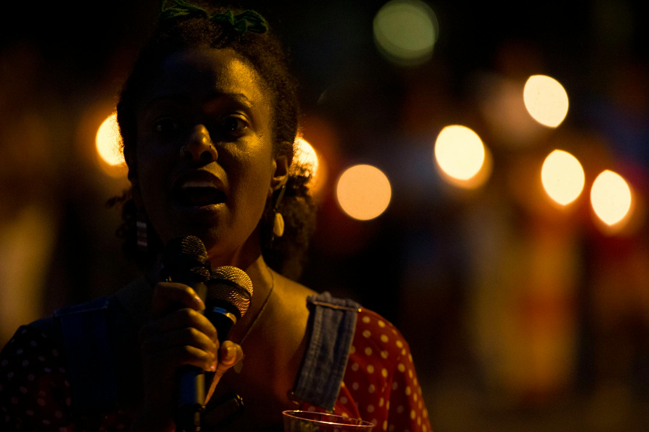 Jayanthi Kyle sang multiple emotional and uplifting songs as community members stood together in a circle surrounding her to close out the vigil. ] ALEX KORMANN � alex.kormann@startribune.com Dozens of local community members, family of Thurman Belvins and activists gathered at the corner of 48th street and Camden Ave on Sunday evening for a candle lit vigil to remember the life of Belvins who died Saturday. Belvins was shot by police starting on that same corner Saturday afternoon. Community me