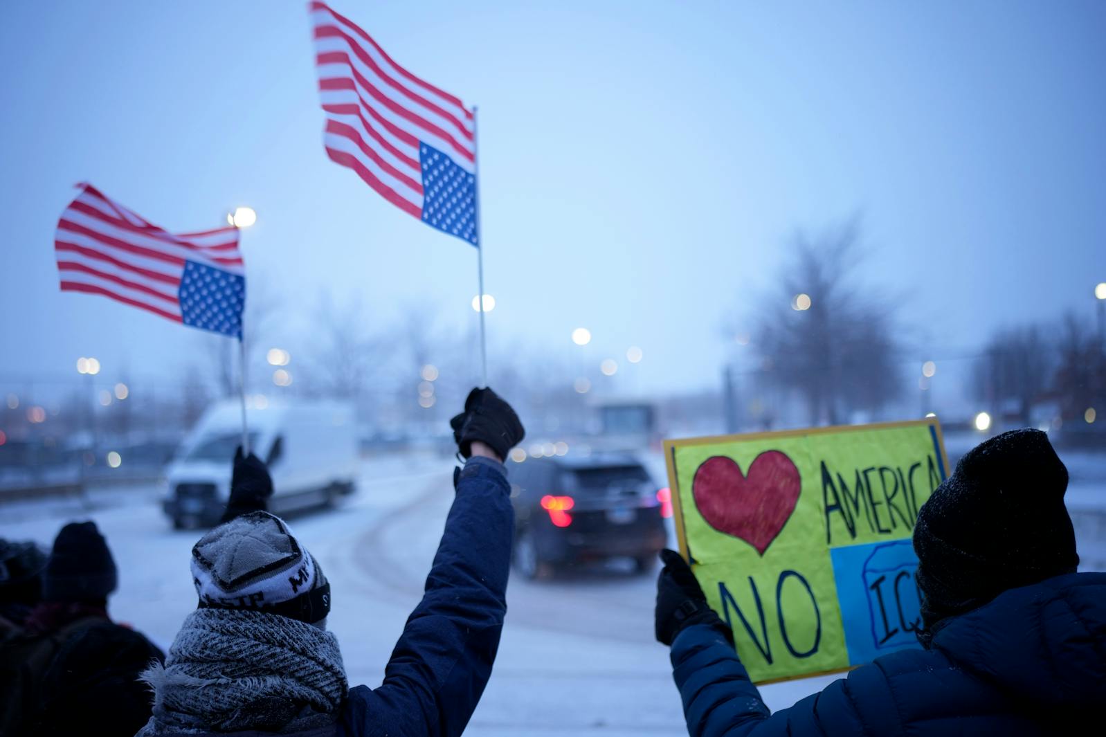 Protesters demonstrate outside of the Whipple Federal Building in Fort Snelling on Sunday, Jan. 18.