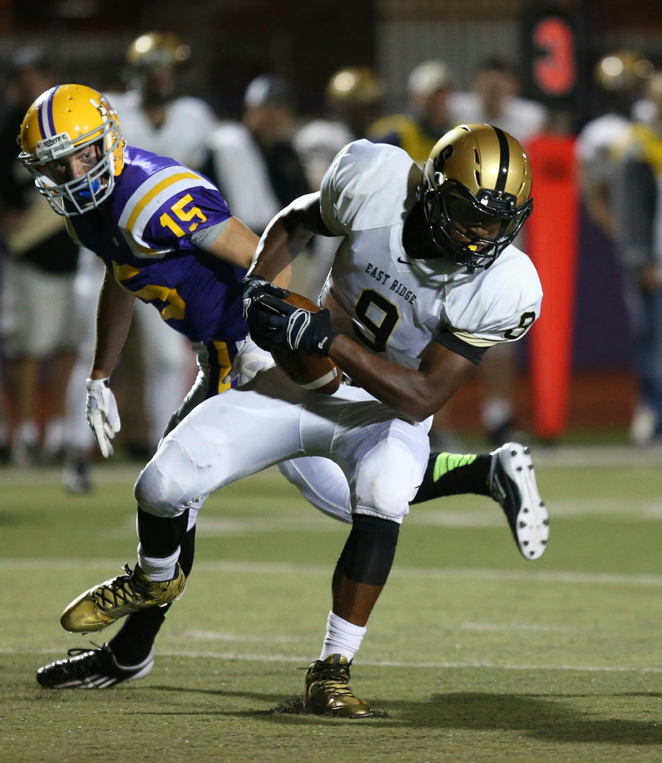 East Ridge's Kjetil Cline made the catch and then ran into the end zone for East Ridge's second touchdown in the first half. ] (KYNDELL HARKNESS/STAR TRIBUNE) kyndell.harkness@startribune.com Cretin-Derham Hall vs East Ridge in St. Paul Min., Friday, August, 5, 2014.