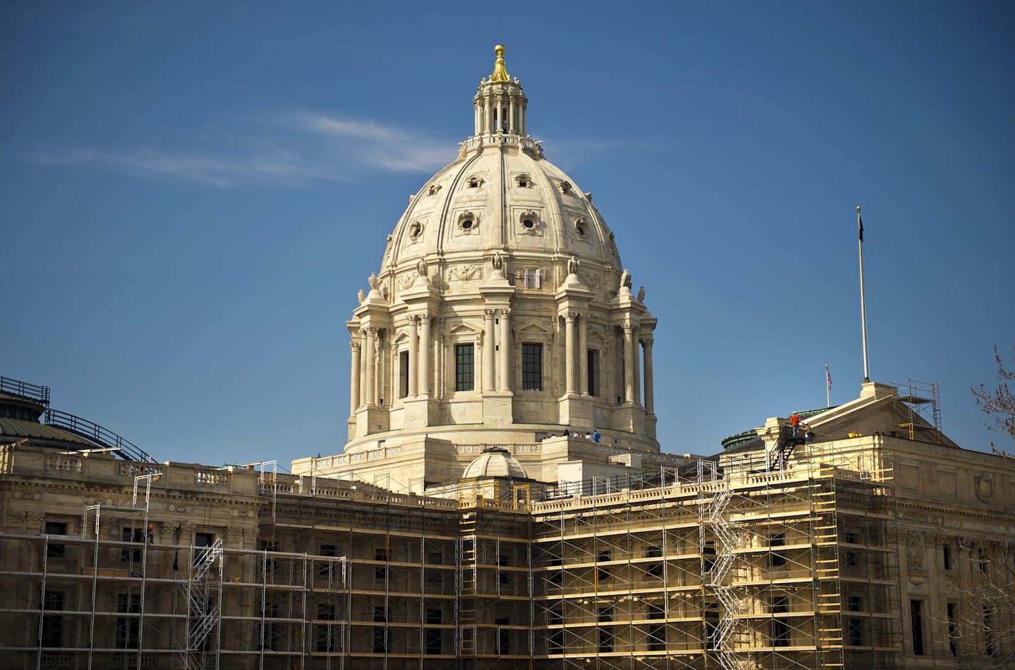 The exterior of the Minnesota State Capitol, covered in scaffolding for a huge renovation project.