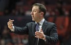 Minnesota head coach Richard Pitino gestures on the sideline in the first half of an NCAA college basketball game against Illinois, Thursday, Jan. 30,