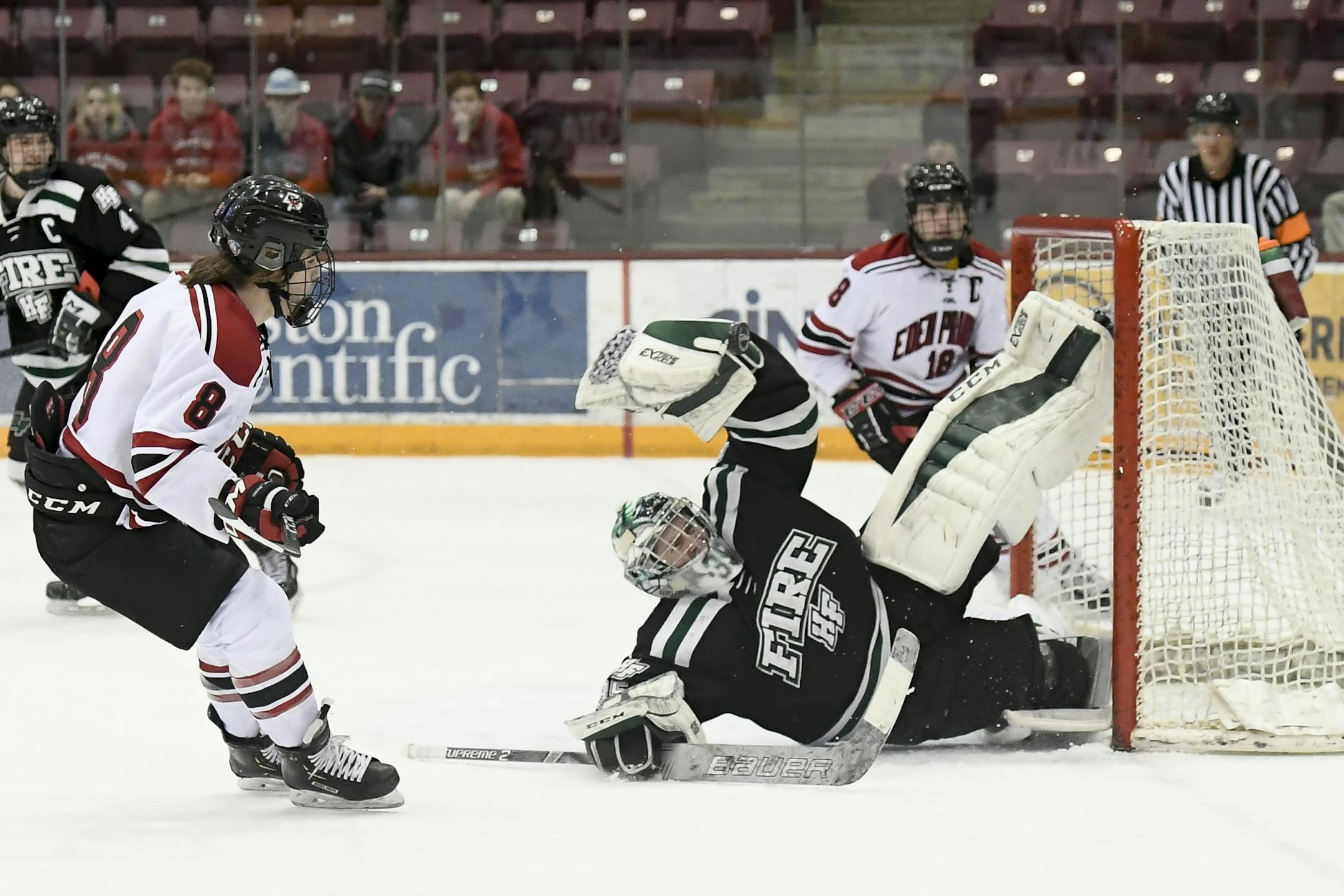 Eden Prairie forward Drew Holt (8) attempted a shot against Holy Family goaltender Bailey Huber (35) in the first period of Wednesday's Section 2AA final.