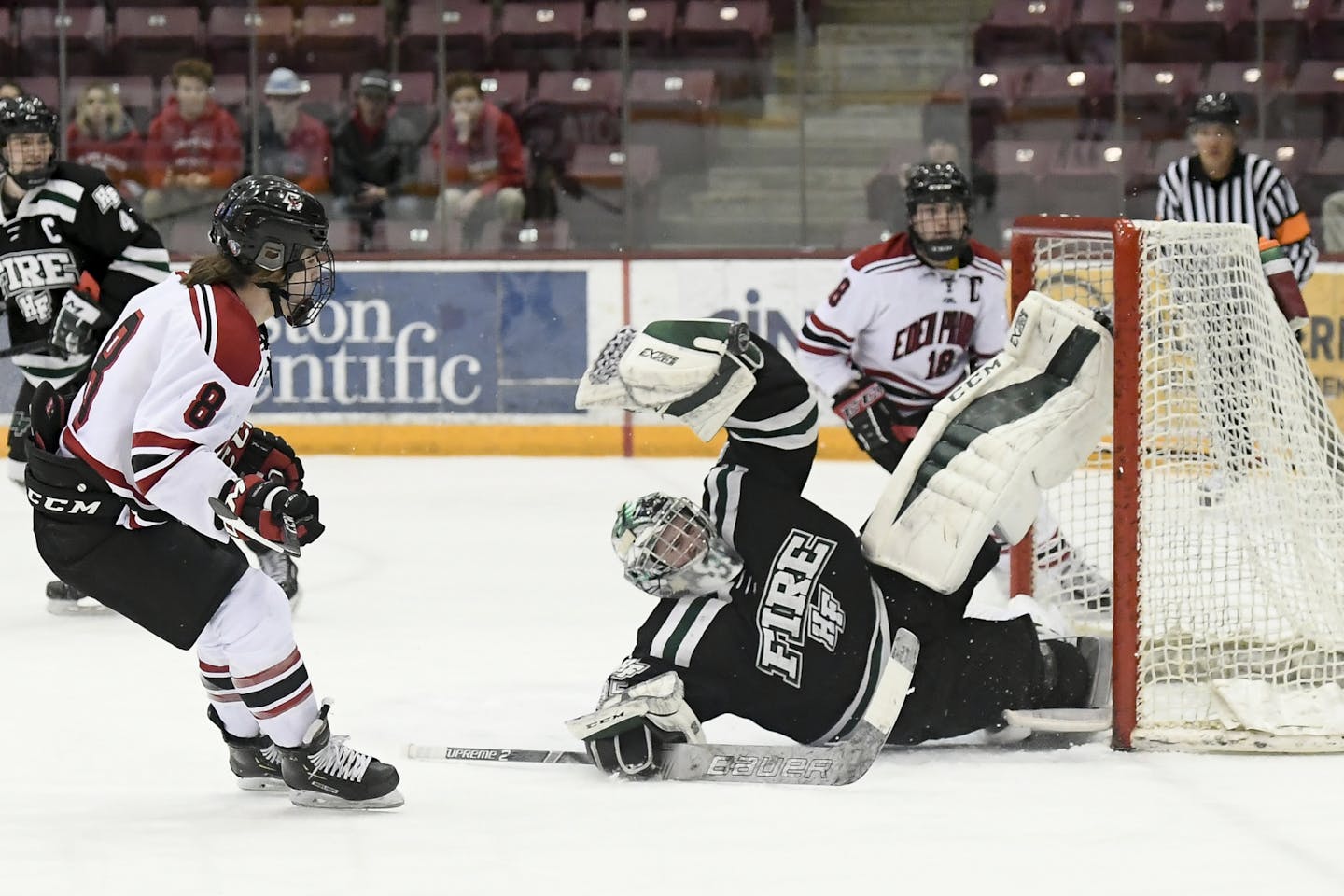 Eden Prairie forward Drew Holt (8) attempted a shot against Holy Family goaltender Bailey Huber (35) in the first period of Wednesday's Section 2AA final.