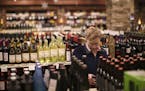 Jesse Martin picked up some beer for New Year's Eve in the Edina Liquor store at 50th & France Wednesday afternoon. ] JEFF WHEELER &#x201a;&#xc4;&#xa2
