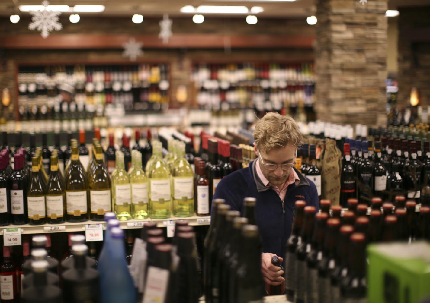 Jesse Martin picked up some beer for New Year's Eve in the Edina Liquor store at 50th & France Wednesday afternoon. ] JEFF WHEELER &#x201a;&#xc4;&#xa2; jeff.wheeler@startribune.com The coming year could prove to be a test of municipal liquor's ability to hold its own against an increasingly crowded field of competitors. The city-owned Edina Liquor store at 50th & France recently underwent a $300,000 remodel - one of the things muni liquor stores are doing to hold their own in an increasingly cro