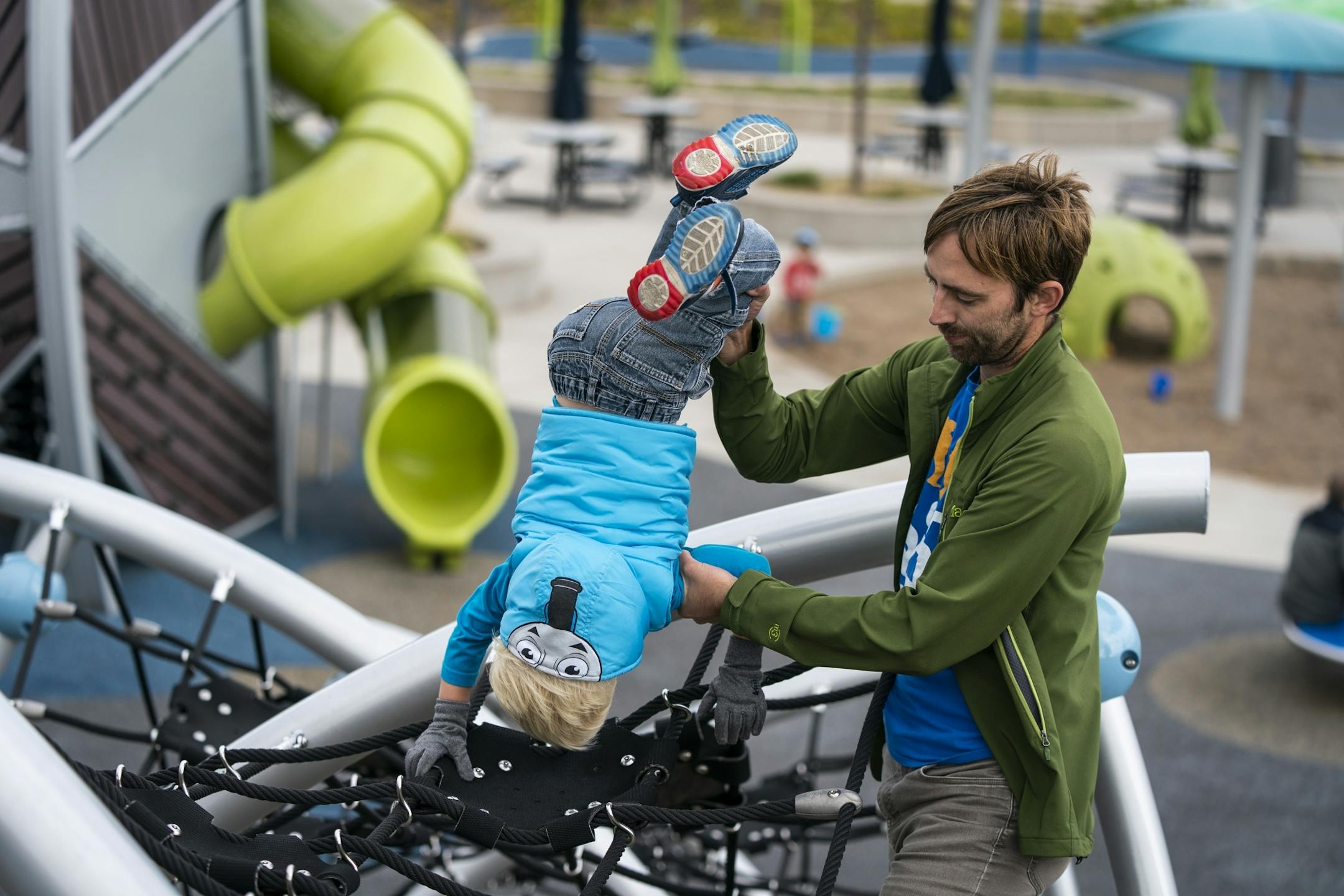 Keith Nagel plays with his son Sawyer, 3, during a Twin Cities Dads playgroup at Central Park in Maple Grove.