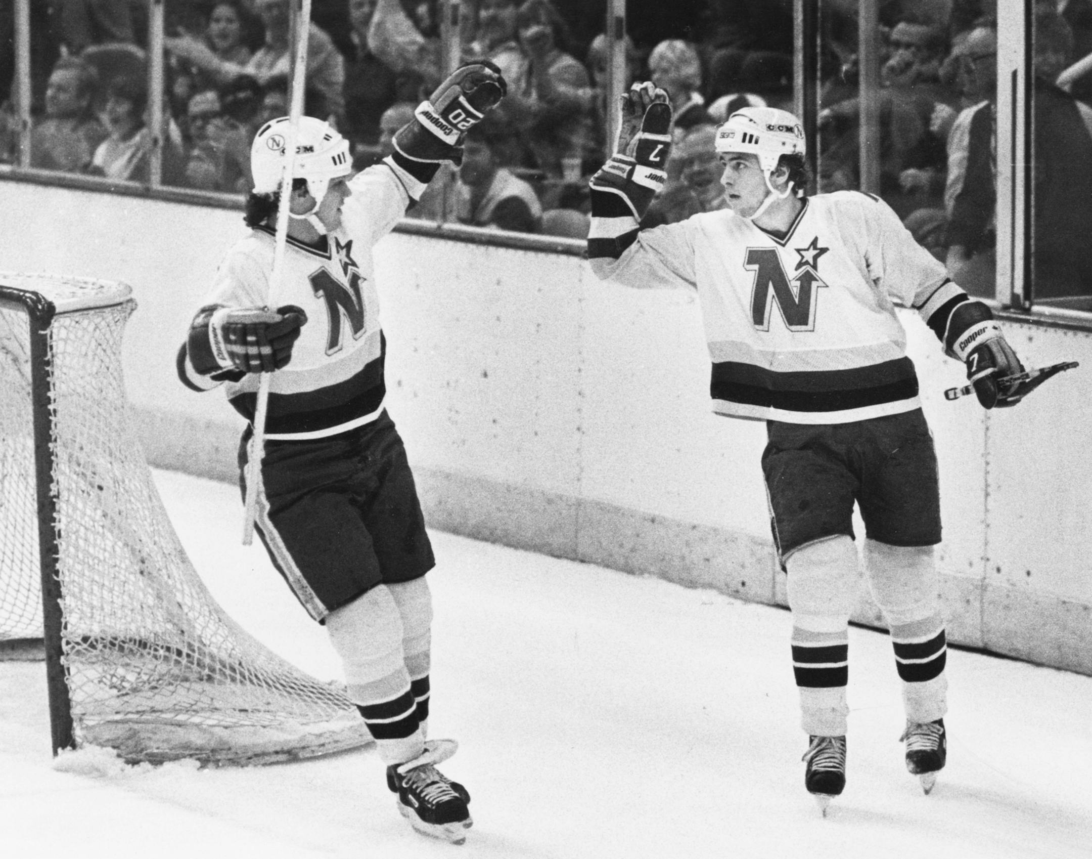 Neal Broten, right, and Dino Ciccarelli