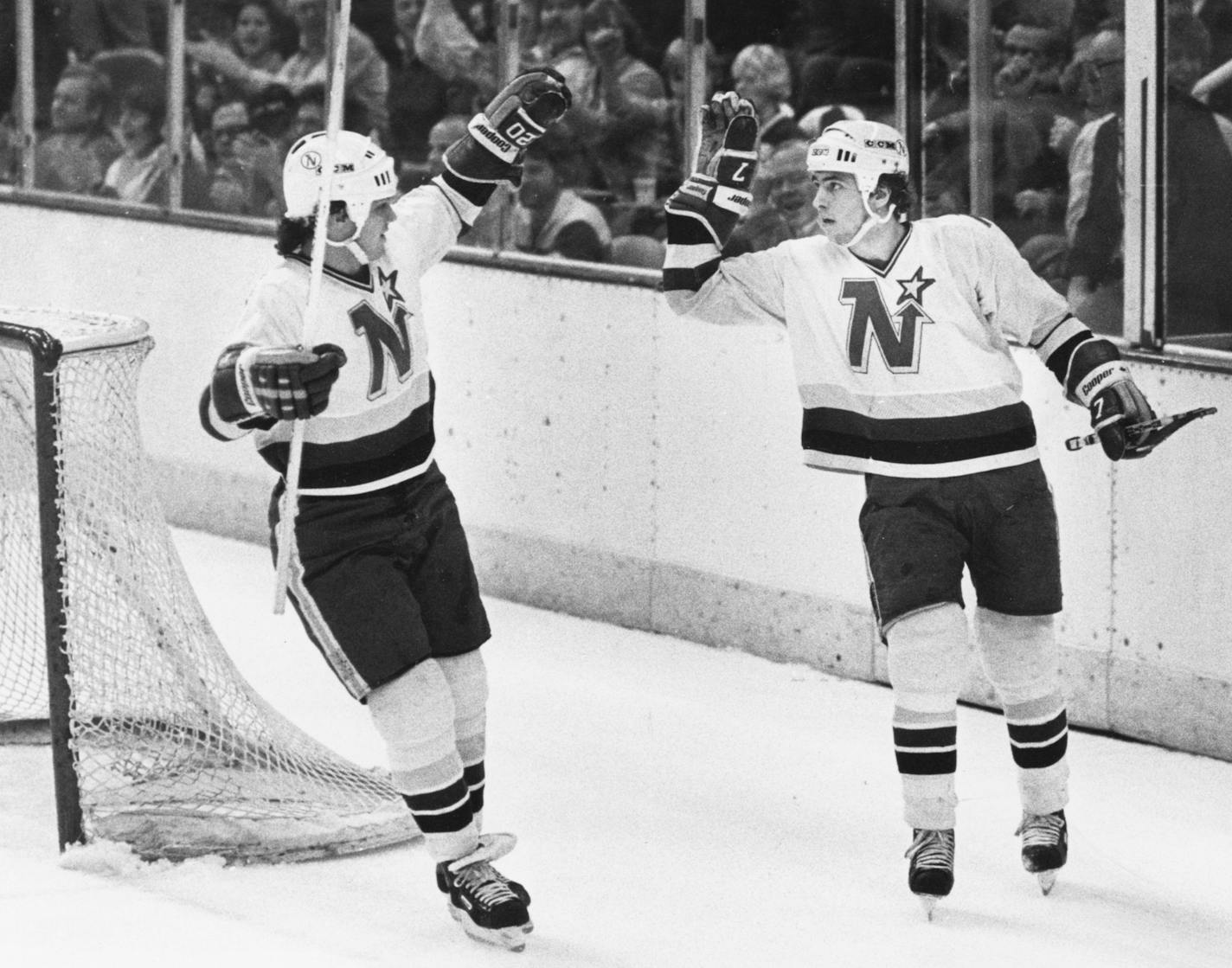 Neal Broten, right, and Dino Ciccarelli