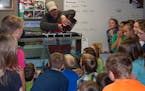 Bemidji elementary school students watched trout eggs put into a special school aquarium as part of a special environmental education project through 
