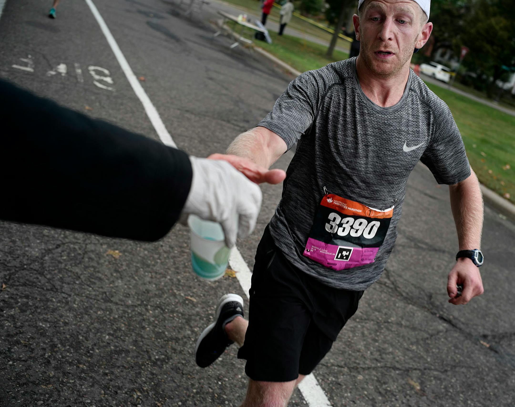 Lucas Windholz(3390) grabbed some Powerade near the 23-mile marker.
