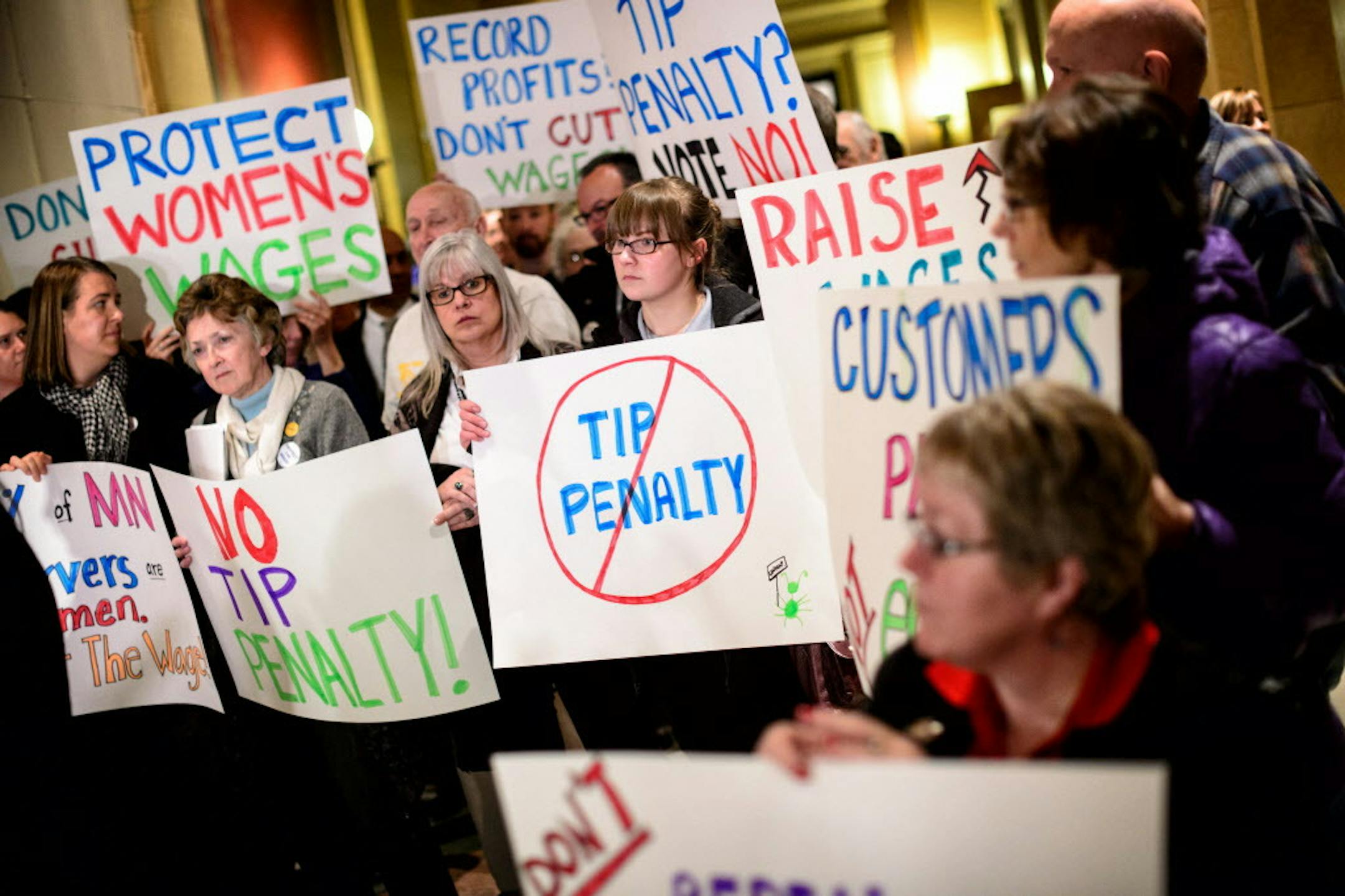 Raise the Wage Minnesota members rallied outside the House chambers at the State Capitol as the House prepared to take up a bill that lower the minimum wage for workers who receive tips as part of their compensation on Monday, March 23, 2015