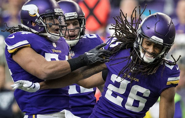 Eric Kendricks (54) celebrated with Trae Waynes (26) after a tackle in the third quarter.