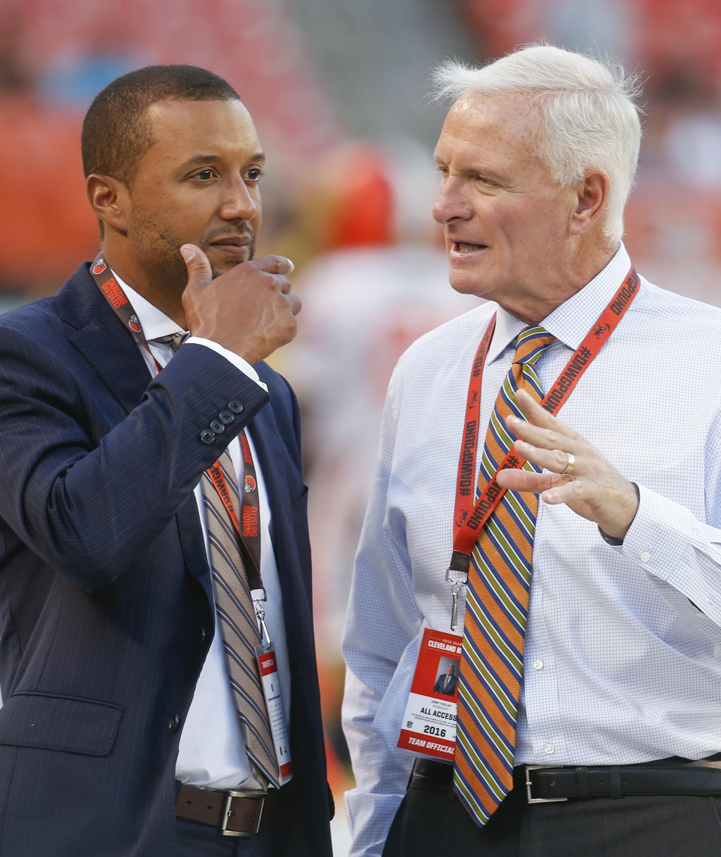 Sashi Brown, acting executive vice president of football operations for the Cleveland Browns, left, speaks with Browns' owner Jimmy Haslam on the field during practice before an NFL preseason football game against the Atlanta Falcons, Thursday, Aug. 18, 2016, in Cleveland. (AP Photo/Ron Schwane) ORG XMIT: OHJMOTK