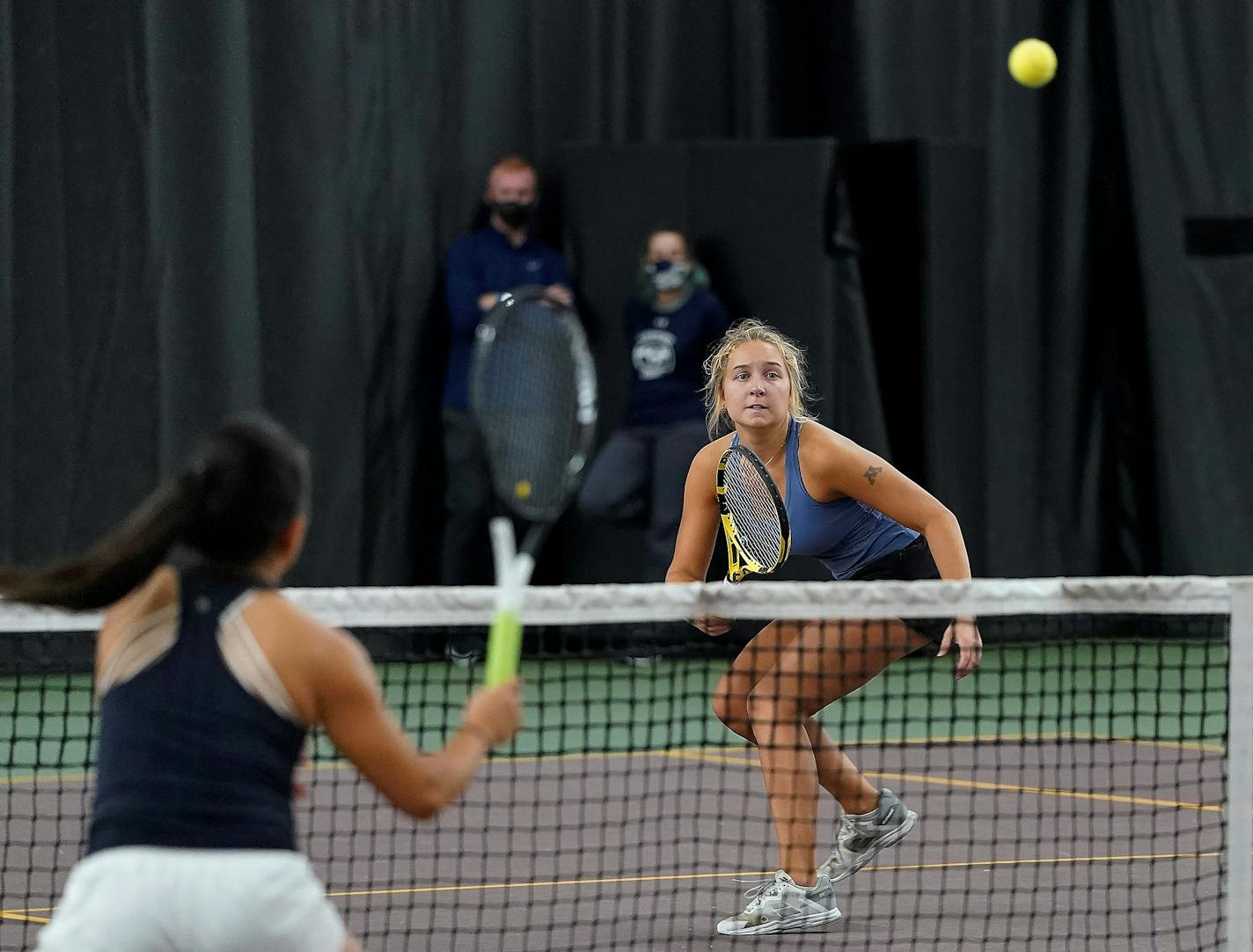 Minnetonka High doubles player Karina Elvestrom watches as her shot goes over the net towards Century High's Julia Baber during the Class 2A Girls' tennis state doubles championship at the Baseline Tennis Center Saturday, Oct. 30, 2021, in Minneapolis, Minn. ] DAVID JOLES • david.joles@startribune.com