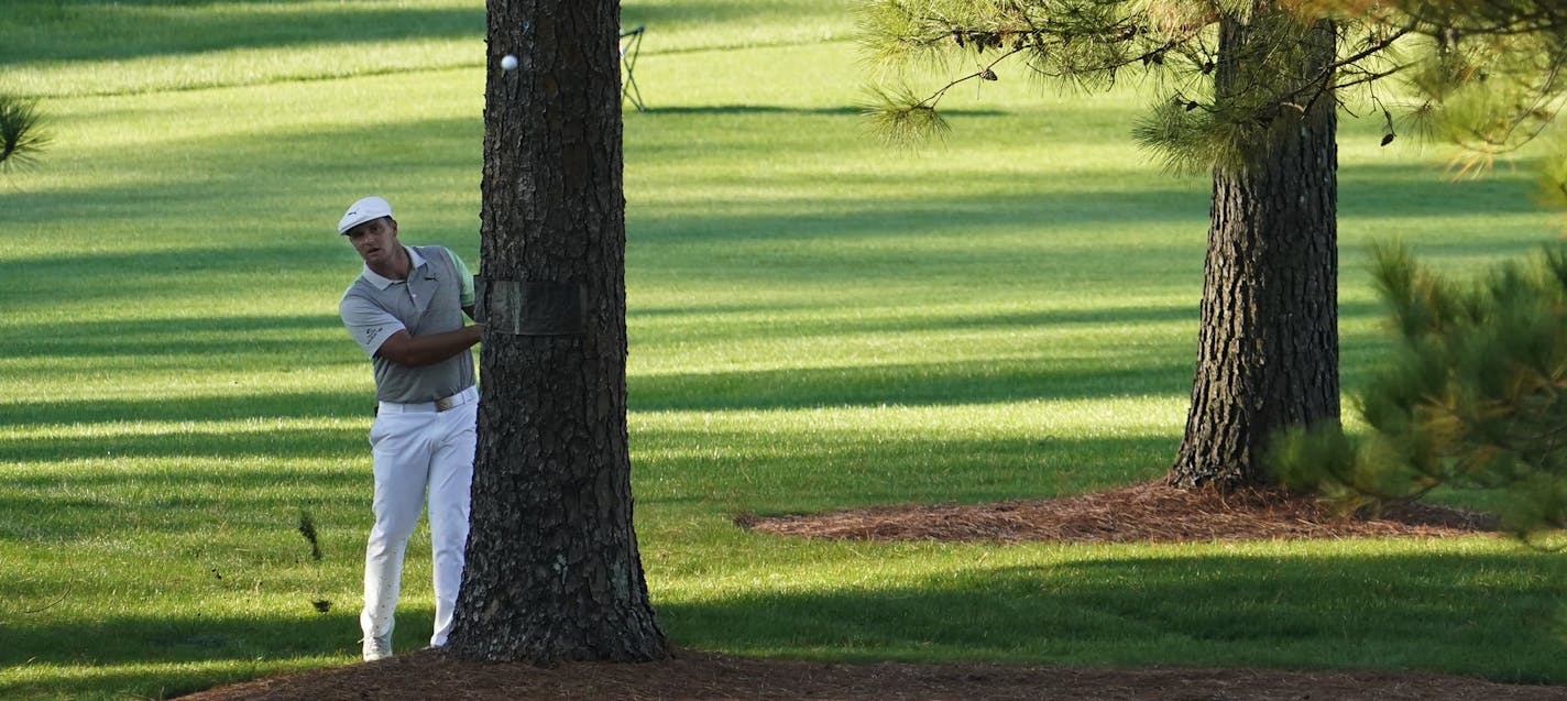 Bryson DeChambeau hits out of the rough on the seventh hole during the second round of the Masters golf tournament Friday, Nov. 13, 2020, in Augusta, Ga. (AP Photo/David J. Phillip)