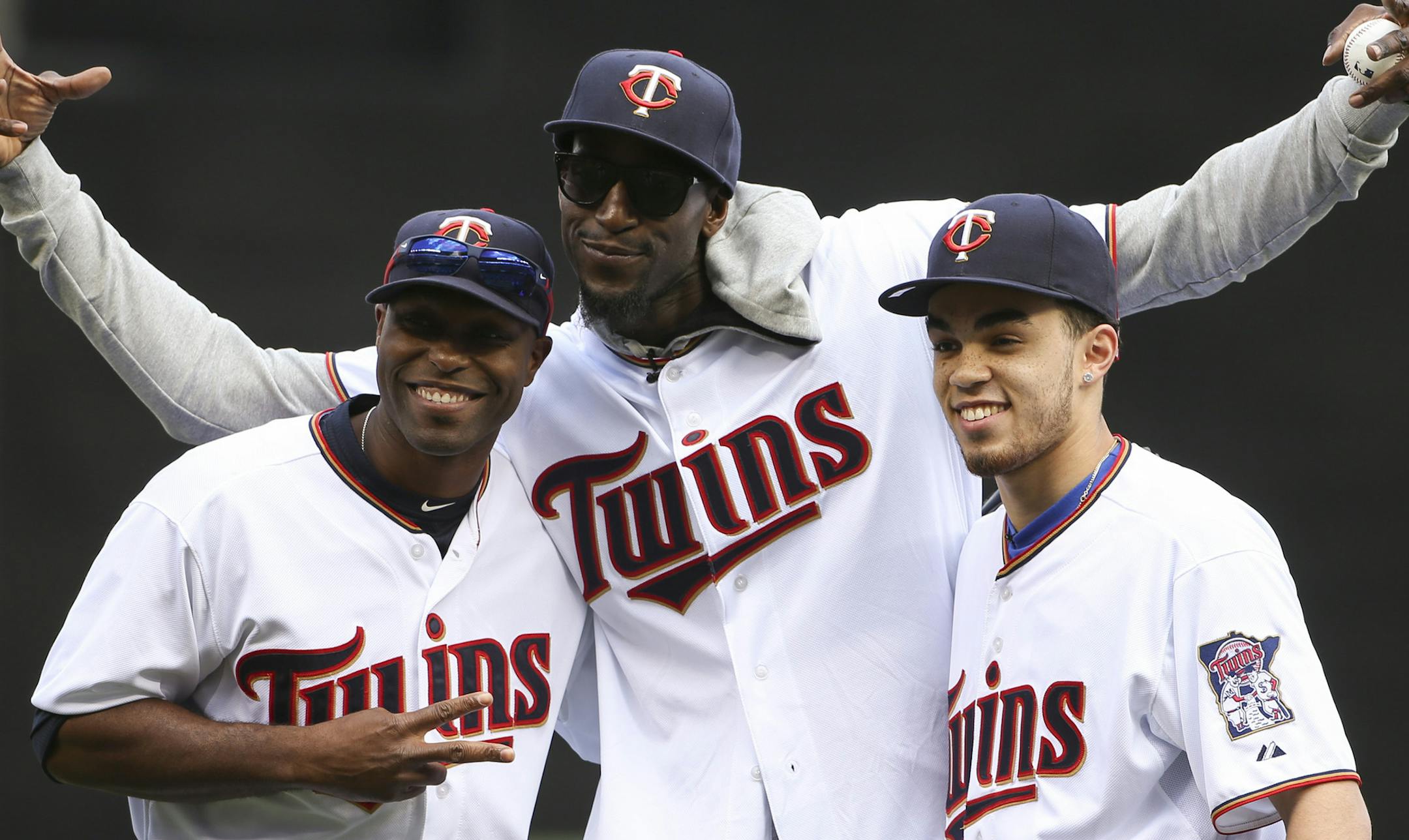 The Twins' Torii Hunter, The Wolves' Kevin Garnett, and Duke's Tyus Jones, from left, posed for a photo after Garnett threw the ceremonial first pitch to Hunter before the home opener Monday afternoon at Target Field. ] JEFF WHEELER ï jeff.wheeler@startribune.com The Minnesota Twins faced the Kansas City Royals in their home opener Monday afternoon, April 13, 2015 at Target Field in Minneapolis.