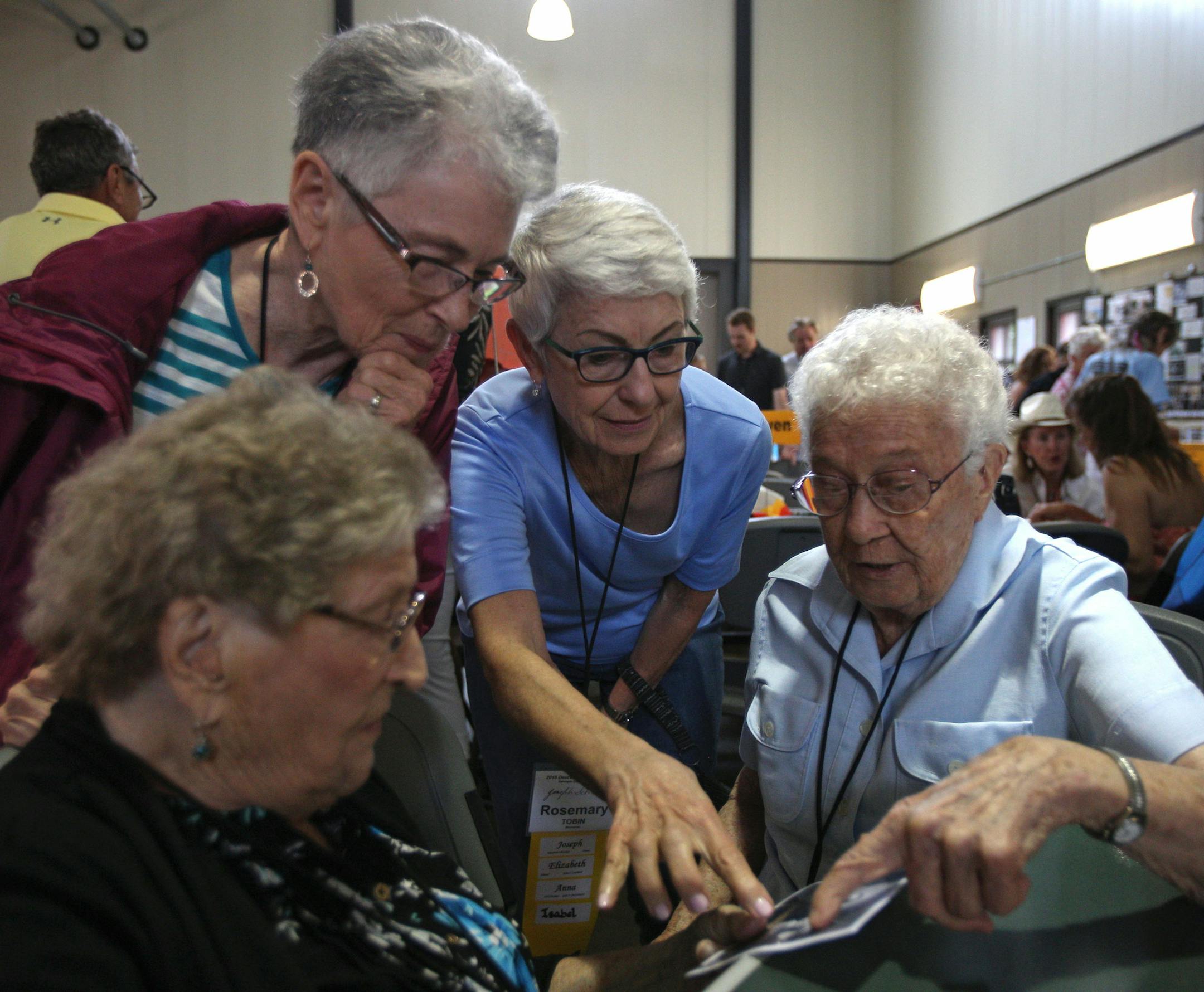 (From left) Lil Leuthard Ritter, Sheila Tobin Hanson, Rosemary Tobin and Sister Agatha Grossman look at an old photo of Joseph Schmid and his immediate family. ] ALEX KORMANN &#x2022; alex.kormann@startribune.com Nearly 400 people from across the U.S. gathered at Gale Woods Farm in Minnetrista, MN for a reunion of the Schmid family on Saturday June 16, 2018. The even was organized by Toni Schimd Stevenson, the great-great-granddaughter of Joseph Schmid, one of the shared ancestors of everyone in
